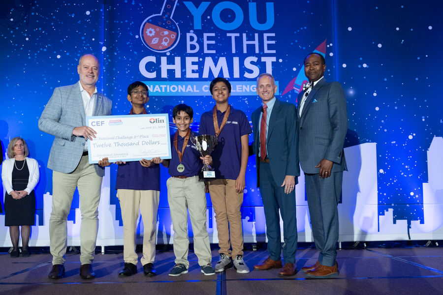 C0deEX team accepting the National Challenge 2nd place award with a $12,000 scholarship check